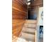 Stairs leading up with wood paneling on the walls at 3081 Woodridge Rd, Shelbyville, IN 46176