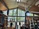 Well-lit workshop with a large window and ample storage, ideal for woodworking and various projects at 3081 Woodridge Rd, Shelbyville, IN 46176