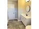 Bathroom with a white vanity, white door, and gray tiled floor, providing a clean look at 337 N Beville Ave, Indianapolis, IN 46201