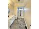 Modern bathroom featuring a tiled walk-in shower with decorative accents and marble flooring at 337 N Beville Ave, Indianapolis, IN 46201