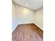 Small bedroom featuring neutral walls and wood laminate flooring at 337 N Beville Ave, Indianapolis, IN 46201