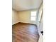 Bedroom featuring neutral walls and wood laminate flooring at 337 N Beville Ave, Indianapolis, IN 46201