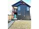 Contemporary two-story home featuring clean lines, balcony, and modern design at 337 N Beville Ave, Indianapolis, IN 46201