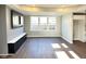 Bright living room featuring hardwood floors and a contemporary accent wall design at 337 N Beville Ave, Indianapolis, IN 46201