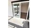 Inviting outdoor patio with modern railing, wood-look flooring, and sliding glass doors to interior at 337 N Beville Ave, Indianapolis, IN 46201