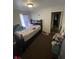 Bedroom featuring neutral walls, one window, and carpeted flooring at 3731 N Tacoma Ave, Indianapolis, IN 46218