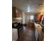 Functional kitchen featuring wood cabinets, gas range, and white appliances at 3731 N Tacoma Ave, Indianapolis, IN 46218