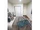 Bedroom with soft, neutral colors, wood-look floors, and closet with bi-fold doors at 3811 N Lawndale Ave, Indianapolis, IN 46254