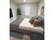 Bedroom boasts wood-look floors, neutral colors, and a window for natural light at 3811 N Lawndale Ave, Indianapolis, IN 46254
