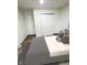Bedroom featuring wood-look floors and closet with bi-fold doors at 3811 N Lawndale Ave, Indianapolis, IN 46254