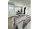 Bedroom with a desk, door to the outside, a large window, and a closet at 3811 N Lawndale Ave, Indianapolis, IN 46254