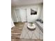 Inviting living room featuring a neutral palette, wood-look floors, and a modern decorative rug at 3811 N Lawndale Ave, Indianapolis, IN 46254