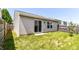 View of the private, grassy backyard with a fence and access to the house through a sliding glass door at 4033 Tahoe Dr, Indianapolis, IN 46235