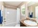 Bathroom featuring a shower-tub combination, vanity with sink, and natural light at 4033 Tahoe Dr, Indianapolis, IN 46235