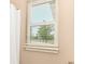 Close up of a window with blinds with view of trees and sky in bathroom at 4033 Tahoe Dr, Indianapolis, IN 46235