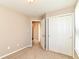 Bright bedroom featuring neutral walls, plush carpeting, and a closet with sliding doors at 4033 Tahoe Dr, Indianapolis, IN 46235