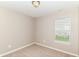 Well-lit bedroom featuring a window with blinds, neutral walls and plush carpeting at 4033 Tahoe Dr, Indianapolis, IN 46235