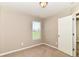 Bright bedroom featuring a window with blinds and neutral walls and plush carpeting at 4033 Tahoe Dr, Indianapolis, IN 46235