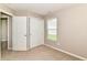 Neutral bedroom with carpet and standard lighting and a door leading to another room at 4033 Tahoe Dr, Indianapolis, IN 46235