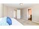 Neutral bedroom with carpet and two doors to a bathroom and a closet at 4033 Tahoe Dr, Indianapolis, IN 46235