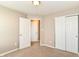 Bright bedroom featuring neutral walls, plush carpeting, and a closet with sliding doors at 4033 Tahoe Dr, Indianapolis, IN 46235