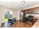 Cozy dining area adjacent to kitchen with hardwood floors and stainless steel appliances at 4033 Tahoe Dr, Indianapolis, IN 46235