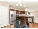 Stylish kitchen featuring stainless steel appliances and sleek, dark wood cabinetry at 4033 Tahoe Dr, Indianapolis, IN 46235