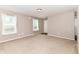 Spacious living room with neutral carpet, bright windows, and fresh paint at 4033 Tahoe Dr, Indianapolis, IN 46235