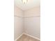 Carpeted walk-in closet with a set of built-in wire shelving on the back wall at 4033 Tahoe Dr, Indianapolis, IN 46235