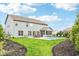 Expansive backyard with a fenced in pool, patio, and landscaped areas perfect for outdoor entertaining at 4204 Omaha Dr, Bargersville, IN 46106