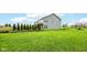 Beautifully manicured backyard featuring a spacious lawn and well-maintained landscaping providing a serene outdoor space at 4204 Omaha Dr, Bargersville, IN 46106
