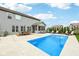 Backyard with swimming pool, manicured lawn, dining set, lounge chairs, and patio area at 4204 Omaha Dr, Bargersville, IN 46106