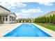 Backyard view featuring an in-ground pool, well-manicured lawn, and tasteful landscaping at 4204 Omaha Dr, Bargersville, IN 46106