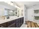 Bathroom with double vanity, granite countertops, and a glass-enclosed shower at 4204 Omaha Dr, Bargersville, IN 46106