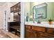 Elegant bathroom with a wood vanity, quartz countertop, and convenient mudroom access at 4204 Omaha Dr, Bargersville, IN 46106