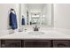 Bathroom vanity featuring a white countertop and dark brown cabinets with modern fixtures and towel rack at 4204 Omaha Dr, Bargersville, IN 46106