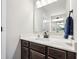 Well-lit bathroom featuring quartz countertop, mirror, modern vanity with view of infinity at 4204 Omaha Dr, Bargersville, IN 46106