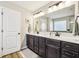 Bathroom with double vanity, granite countertops, and a glass-enclosed shower at 4204 Omaha Dr, Bargersville, IN 46106