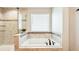 Close-up of the soaking tub with bronze fixtures and a separate glass shower at 4204 Omaha Dr, Bargersville, IN 46106