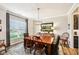 Bright dining room featuring a large window, wood table, and modern light fixture, perfect for Gathering gatherings at 4204 Omaha Dr, Bargersville, IN 46106