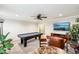Game room with pool table, leather furniture, ceiling fan, and entertainment area at 4204 Omaha Dr, Bargersville, IN 46106