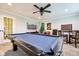 Spacious game room with pool table, ceiling fan, and various entertainment options for a fun and relaxed atmosphere at 4204 Omaha Dr, Bargersville, IN 46106
