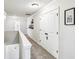Upstairs hallway with carpet flooring and white paneled doors at 4204 Omaha Dr, Bargersville, IN 46106