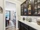 Elegant kitchen featuring dark cabinetry, quartz countertops, and wine storage at 4204 Omaha Dr, Bargersville, IN 46106