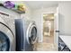 Convenient laundry room featuring a modern washer and dryer with view of hallway at 4204 Omaha Dr, Bargersville, IN 46106