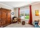 Bright room with a large window overlooking the backyard pool and patio area at 4204 Omaha Dr, Bargersville, IN 46106