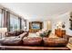 Bright and airy living room features a large brown leather sectional and a custom media center at 4204 Omaha Dr, Bargersville, IN 46106