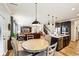 Open layout with living room and kitchen, hardwood floors and leather furniture at 4204 Omaha Dr, Bargersville, IN 46106