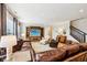 Spacious living room features a large brown leather sectional, media center, and an area rug at 4204 Omaha Dr, Bargersville, IN 46106
