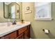 Charming powder room with a wood vanity, quartz countertop, and modern fixtures at 4204 Omaha Dr, Bargersville, IN 46106